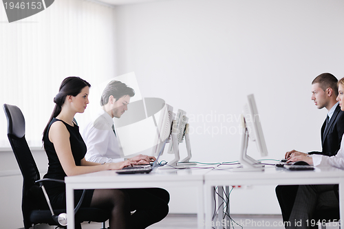 Image of business people group working in customer and help desk office