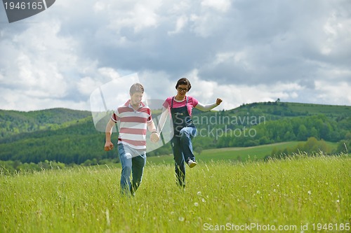 Image of romantic young couple in love together outdoor