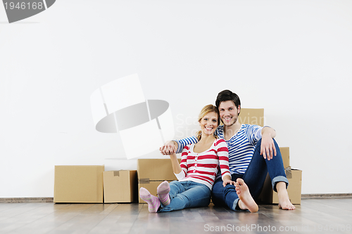 Image of Young couple moving in new house