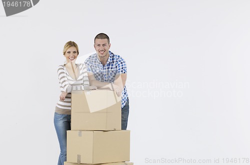 Image of Young couple moving in new home