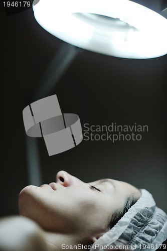 Image of woman with facial mask in cosmetic studio