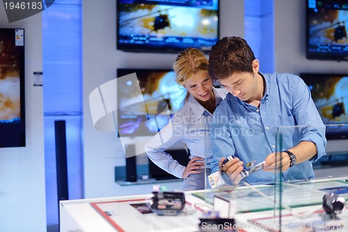 Image of people buy  in consumer electronics store