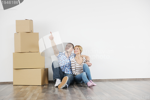 Image of Young couple moving in new home