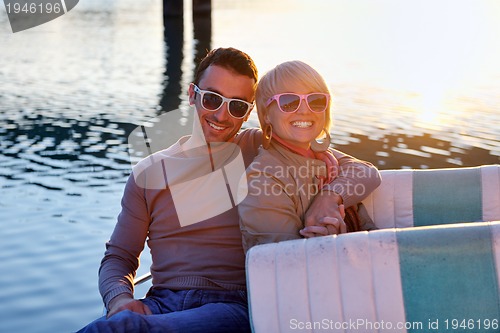 Image of couple in love  have romantic time on boat