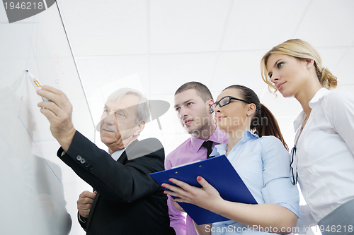 Image of Senior business man giving a presentation