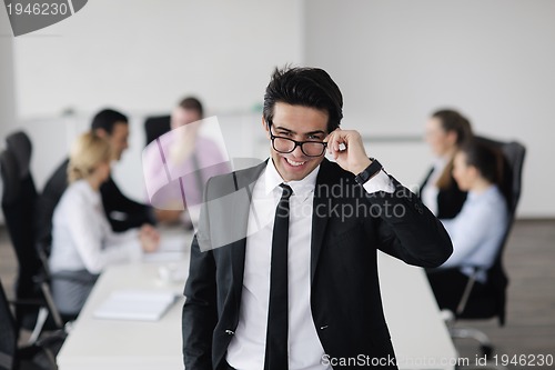 Image of young business man at meeting