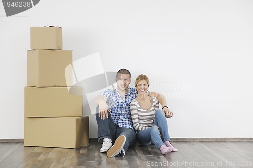 Image of Young couple moving in new home