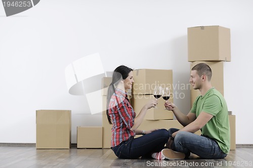 Image of Young couple moving in new home