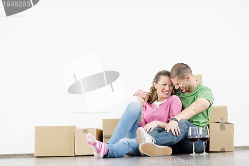 Image of Young couple moving in new house