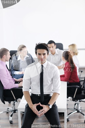 Image of young business man at meeting