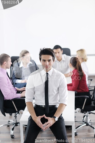 Image of young business man at meeting