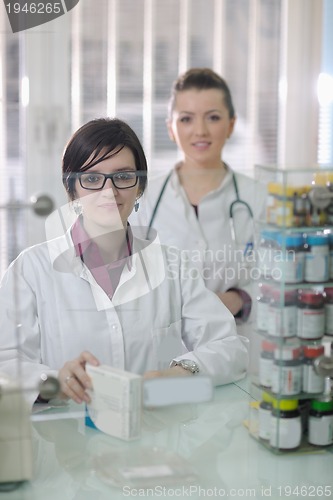 Image of team of pharmacist chemist woman  in pharmacy drugstore