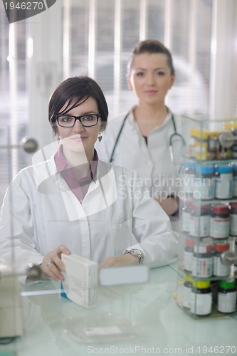 Image of team of pharmacist chemist woman  in pharmacy drugstore