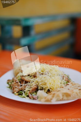 Image of woman eat salad