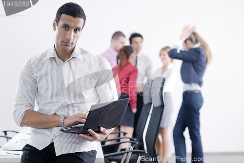 Image of young business man at meeting