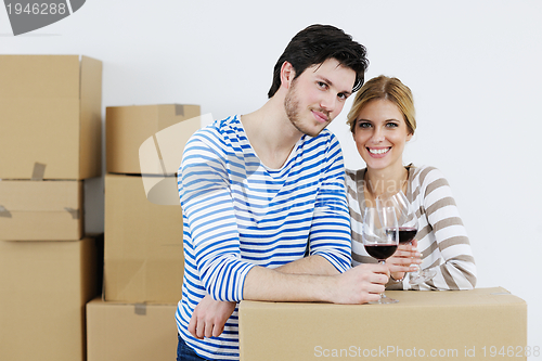 Image of Young couple moving in new house