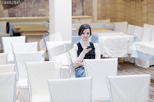 Image of young woman  talking on a phone