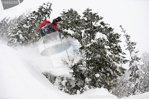 Image of snowboarder on fresh deep snow