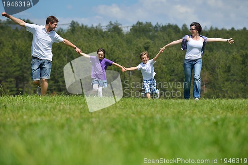 Image of happy young family have fun outdoors