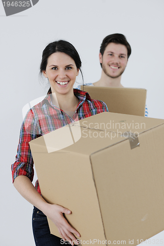 Image of Young couple moving in new house