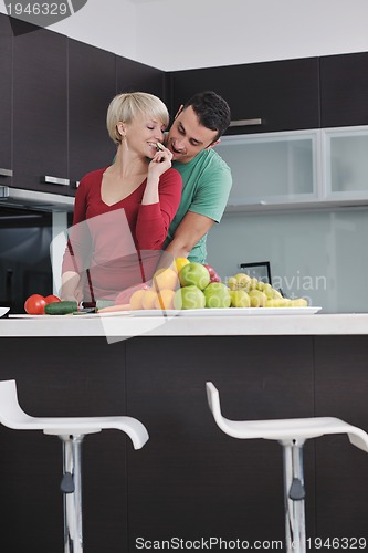 Image of young couple have fun in modern kitchen