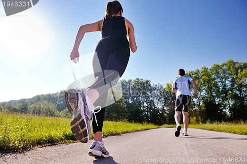 Image of Young couple jogging