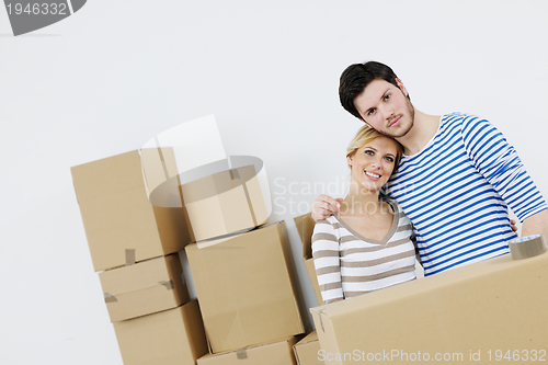 Image of Young couple moving in new house