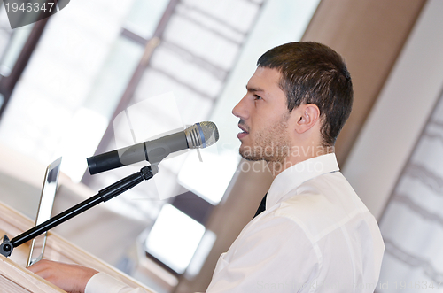 Image of Young  business man giving a presentation on conference