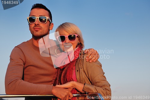 Image of couple in love  have romantic time on boat