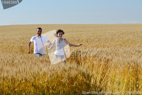 Image of happy couple in wheat field