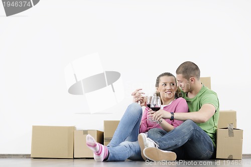 Image of Young couple moving in new home