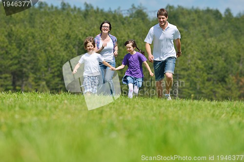 Image of happy young family have fun outdoors