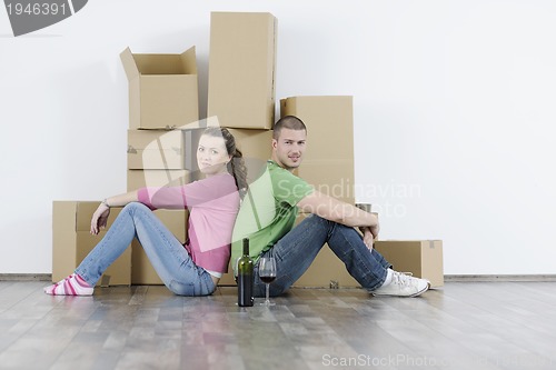 Image of Young couple moving in new home