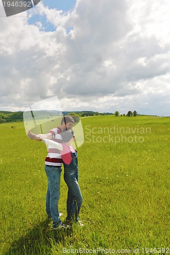 Image of romantic young couple in love together outdoor