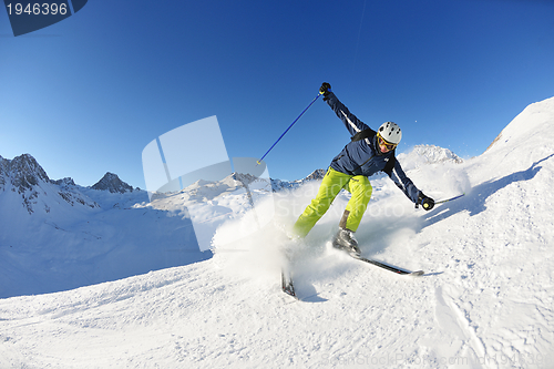 Image of skiing on fresh snow at winter season at beautiful sunny day