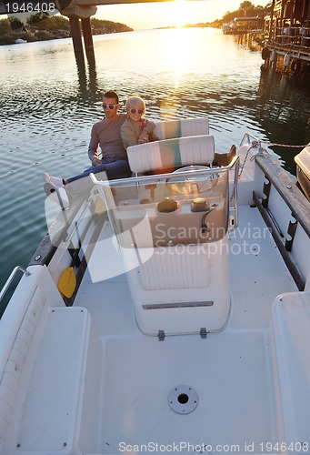 Image of couple in love  have romantic time on boat