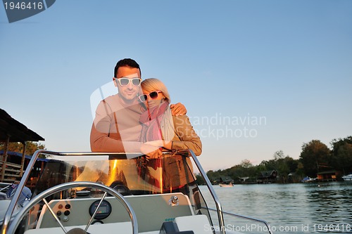 Image of couple in love  have romantic time on boat