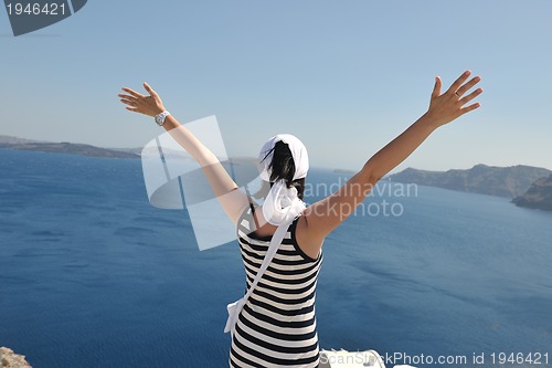 Image of Greek woman on the streets of Oia, Santorini, Greece