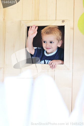 Image of happy child in a window