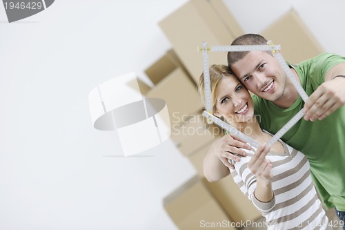 Image of Young couple moving in new home