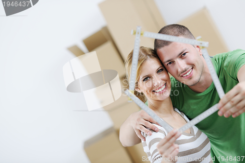 Image of Young couple moving in new house