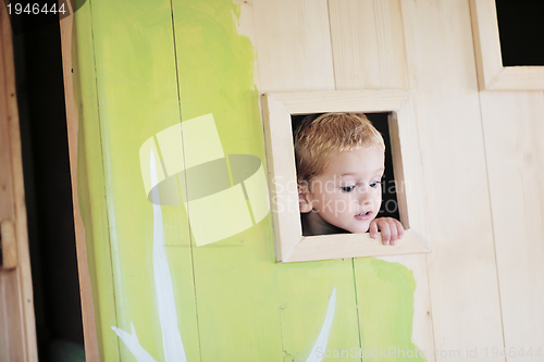 Image of happy child in a window