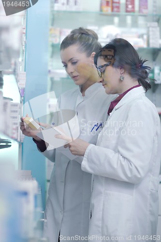 Image of team of pharmacist chemist woman  in pharmacy drugstore