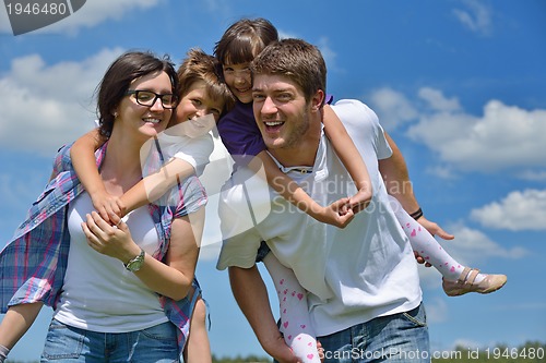 Image of happy young family have fun outdoors