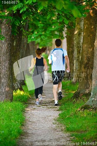 Image of Young couple jogging