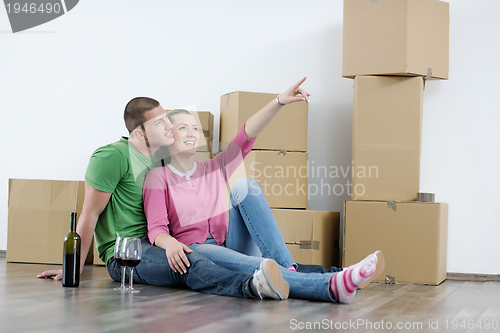 Image of Young couple moving in new house