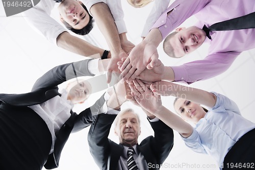 Image of business people group joining hands