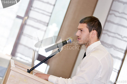 Image of Young  business man giving a presentation on conference