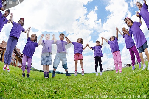 Image of happy kids group  have fun in nature