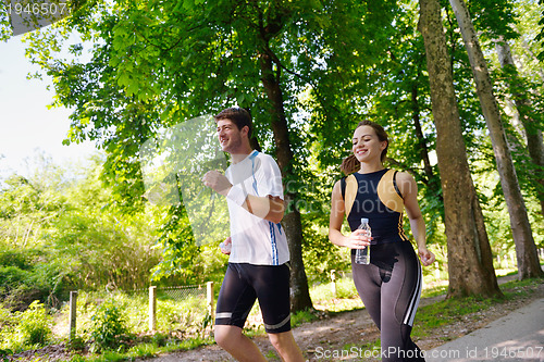 Image of Young couple jogging